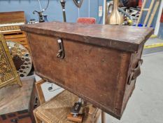 A 19TH CENTURY LEATHER BOUND COACHING TRUNK WITH IRON FITTINGS.