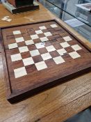 A VICTORIAN ROSEWOOD AND IVORY INLAID FOLDING CHESS / BACKGAMMON BOARD. 49 X 56 cm.