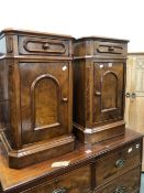 A PAIR OF VICTORIAN WALNUT BEDSIDE CUPBOARDS, EACH WITH A DRAWER ABOVE A CUPBOARD AND PLINTH FOOT