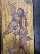 A PAIR AND ANOTHER PAINTING ON OAK PANELS OF CUPIDS ON GOLD GROUNDS WITHIN EBONISED FRAMES, TWO