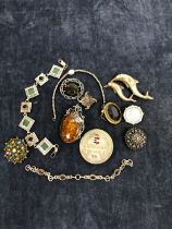 A LARGE SILVER AND AMBER PENDANT BROOCH WITH FOLIATE DESIGN TOGETHER WITH EIGHT FURTHER SILVER AND