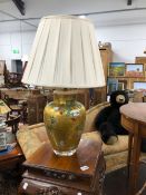 A PAIR OF GOLD GROUND VERRE EGLOMISE OVOID TABLE LAMPS