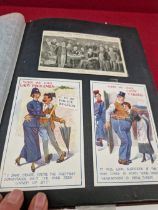 AN ALBUM OF THIRTY FOUR SUFFRAGETTE AND RELATED POSTCARDS AND EPHEMERA