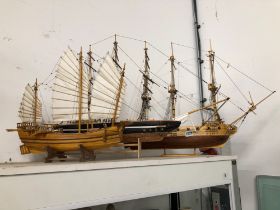 A WOODEN MODEL BATTLE SHIP AND JUNK AND ANOTHER WOODEN SAILING SHIP