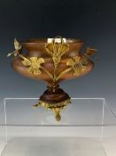 A GILT METAL MOUNTED IRIDESCENT AMBER GLASS BOWL WITH BIRD HANDLES AND WITH ONE LEAF INSCRIBED