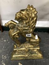 A BRASS RAMPANT LION DOOR STOP. H 37cms.