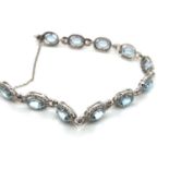 AN 18ct WHITE GOLD HALLMARKED AQUAMARINE AND DIAMOND BRACELET. STATED WEIGHTS ON CLASP DIAMOND 1.