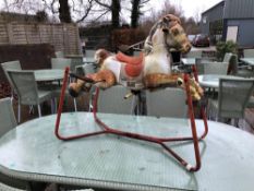 A MOBO TINPLATE ROCKING HORSE.