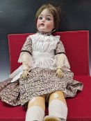 ATTRIBUTED TO CATTERFELDER PUPPENFABRIK, A BISQUE HEADED DOLL WITH SLEEPING EYES AND OPEN MOUTH. H
