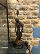A SPELTER CLASSICAL LADY AS A TABLE LAMP, SHE HOLDS A FLOWER OVER HER LEFT SHOULDER. H 61cms.
