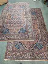 A PAIR OF ANTIQUE PERSIAN KASHAN RUGS. 298 x 132cms