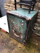 A LARGE ANTIQUE IRON FIRE RESISTING SAFE WITH BRASS FITTINGS. C/W SINGLE KEY.
