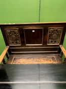 A ANTIQUE OAK ARTS AND CRAFTS HALL SEAT WITH INSET COPPER FOLIATE PANELS