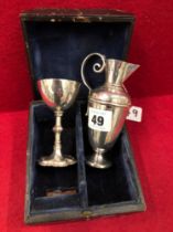 AN ANTIQUE HALLMARKED SILVER CHALICE AND SMALL POURER. GROSS WEIGHT 133grms.