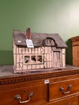 A VINTAGE CHILDS DOLL HOUSE WITH SOME FITTINGS.