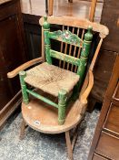 A COUNTRY ARMCHAIR, TOGETHER WITH A RUSTIC RUSH SEAT CHILD'S CHAIR (2)