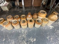 11 TWO TONE STONEWARE JARS TOGETHER WITH THREE FLASKS