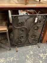 A RETRO WROUGHT IRON FIRE SCREEN