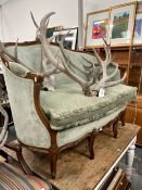 A CARVED FRENCH STYLE SMALL SETTEE