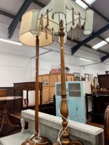 A GILT FLOOR LAMP, TOGETHER WITH A TURNED OAK EXAMPLE (2)