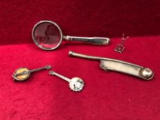 A STAMPED STERLING SILVER BOSUN'S WHISTLE, A HALLMARKED SILVER MAGNIFY GLASS, MUSICAL NOTE AND TWO