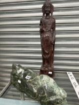 A BRONZED PLASTER STANDING BUDDHA TOGETHER WITH A POLISHED GREEN HARDSTONE SPECIMEN