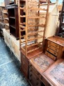 A RUSTIC WINE RACK, TOGETHER WITH A THREE DRAWER OFFICE CABINET (2)