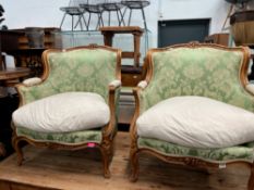 A PAIR OF 19th C. FRENCH WALNUT SHOW FRAME ARMCHAIRS CARVED WITH PAIRS OF FLOWERS CRESTING THE BACKS