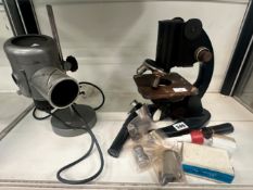 A MICROSCOPE, SOME FITTINGS TO INCLUDE AND ELECTRIC LIGHT SOURCE