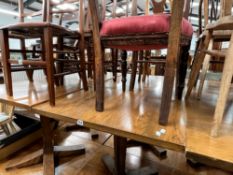 A PAIR OF OAK SQUARE TOP CAFE TABLES (2)