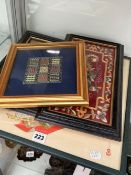 THREE FRAMED ORIENTAL TEXTILE PICTURES TOGETHER WITH A FRAMED SQUARE WORKED IN GOLD THREADS