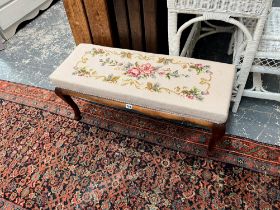 A MAHOGANY LONG STOOL WITH NEEDLE POINT SEAT