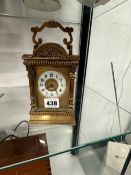 A CARRIAGE CLOCK STRIKING ON A COILED ROD