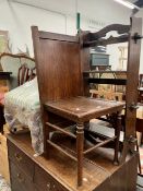 A VINTAGE OAK GENTLE MANS VALET CHAIR TOGETHER WITH A OAK ARTS AND CRAFTS STYLE SMALL BOOKCASE.(2)