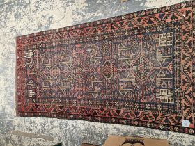 AN AFGHAN TRIBAL RUG