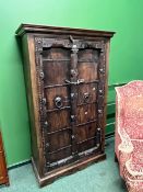 AN EASTERN HARDWOOD IRON BOUND LARGE TWO DOOR CABINET