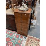 A VINTAGE ELEVEN DRAWER FILING CABINET