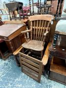 AN ANTIQUE COUNTRY SPINDLE BACK ARMCHAIR, TOGETHER WITH AN OAK ARTS AND CRAFTS MORRIS CHAIR (2)