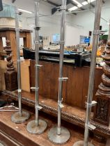 A SET OF FOUR VINTAGE CHROME DISPLAY STANDS (4)