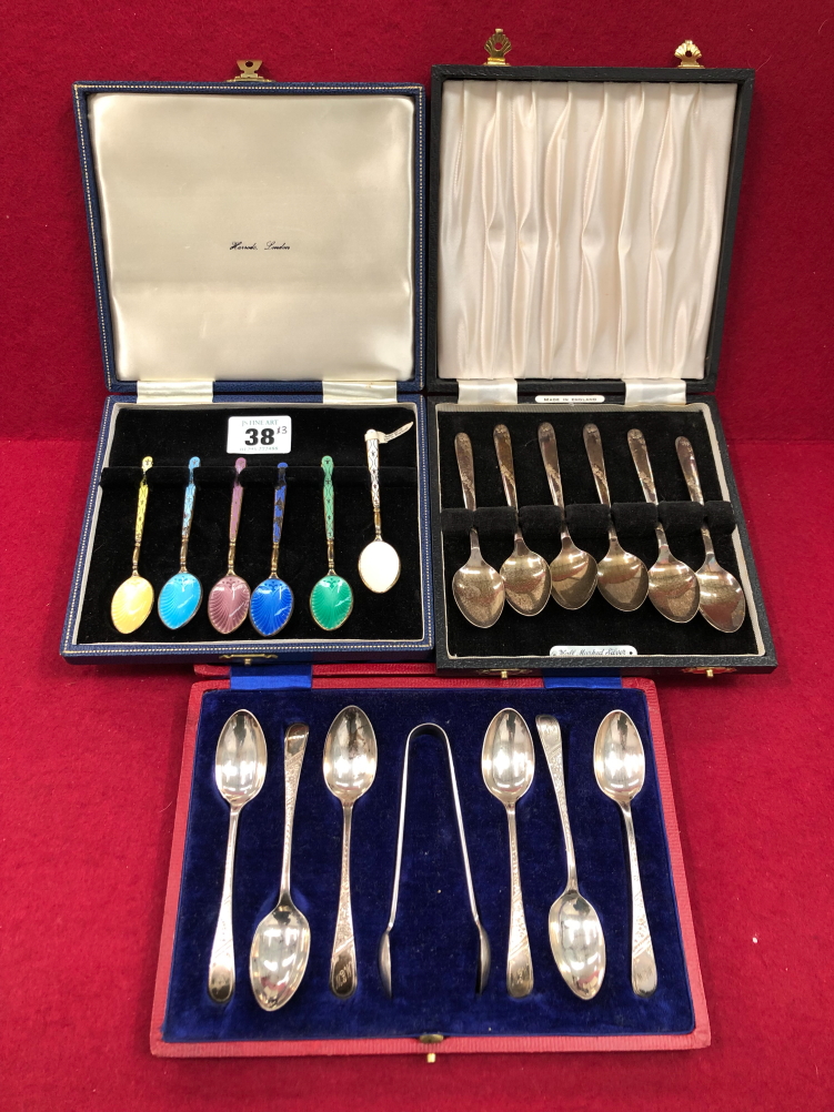 THREE HALLMARKED SILVER CASED CUTLERY SETS TO INCLUDE A HARLEQUIN ENAMEL AND GILDED SET OF COFFEE