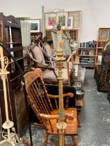 A CARVED GILT WOOD FLOOR LAMP