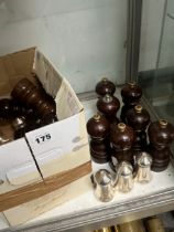 A COLLECTION OF WOODEN PEPPER MILLS