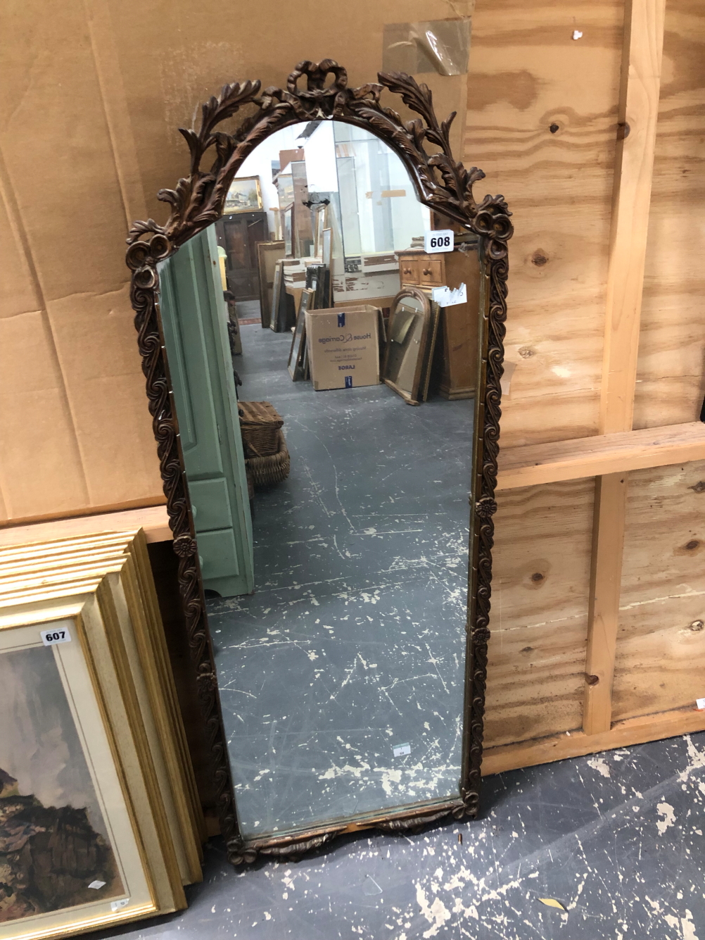A VINTAGE DRESSING MIRROR IN AN ORNATE FRAME