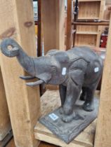 A CARVED HARDWOOD FIGURE OF A ELEPHANT