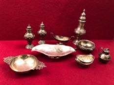HALLMARKED SILVER TO INCLUDE A VICTORIAN SUGAR SIFTER, CRUETS, DECORATIVE DISHES ETC. GROSS WEIGHT