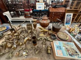 A COLLECTION OF BRASS ANIMALS TOGETHER WITH A COPPER SAMOVAR TABLE LAMP AND A KETTLE