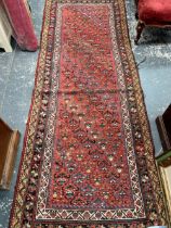 AN ANTIQUE PERSIAN TRIBAL RUNNER