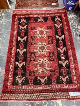 AN AFGHAN TRIBAL RUG. 169 x 115cms