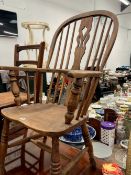 AN ANTIQUE COUNTRY WINDSOR ARM CHAIR, TOGETHER WITH A CANE SEATED SIDE CHAIR.