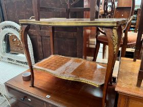 A FRENCH ORMOLU HANDLED AND FRAMED WALNUT TWO TIER COFFEE TABLE INLAID WITH DIAMOND DIAPER, THE